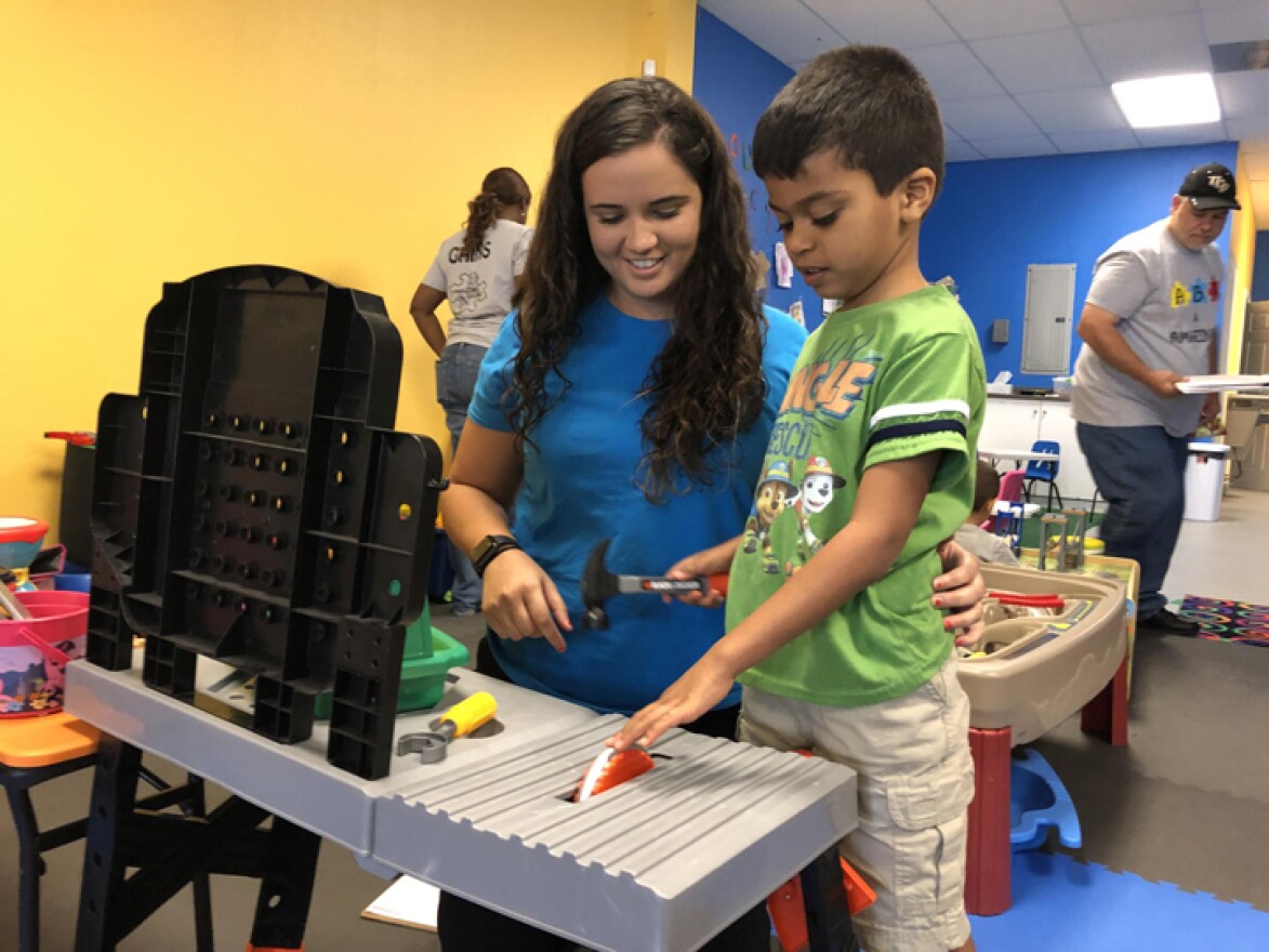 Ana Lopez Del Castillo, a registered behavior technician, works with a child at Amazing Gains Behavior Therapy Services in Orlando.